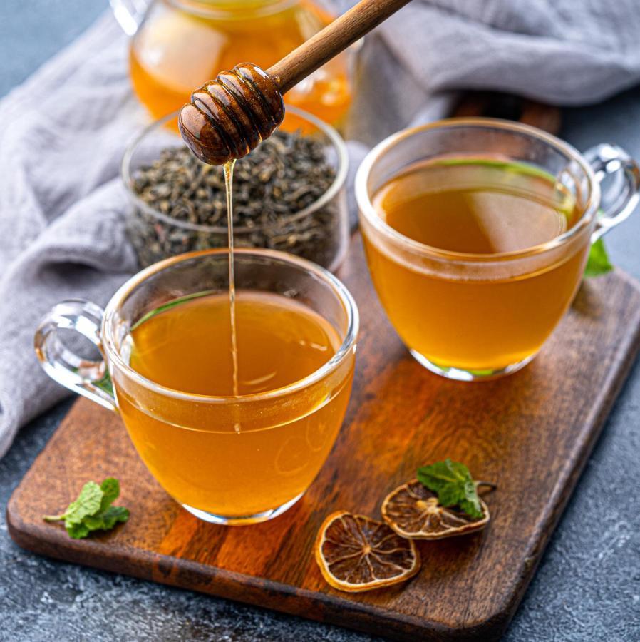塞萨洛尼基凯悦酒店 外观 照片 Honey being drizzled into a cup of tea